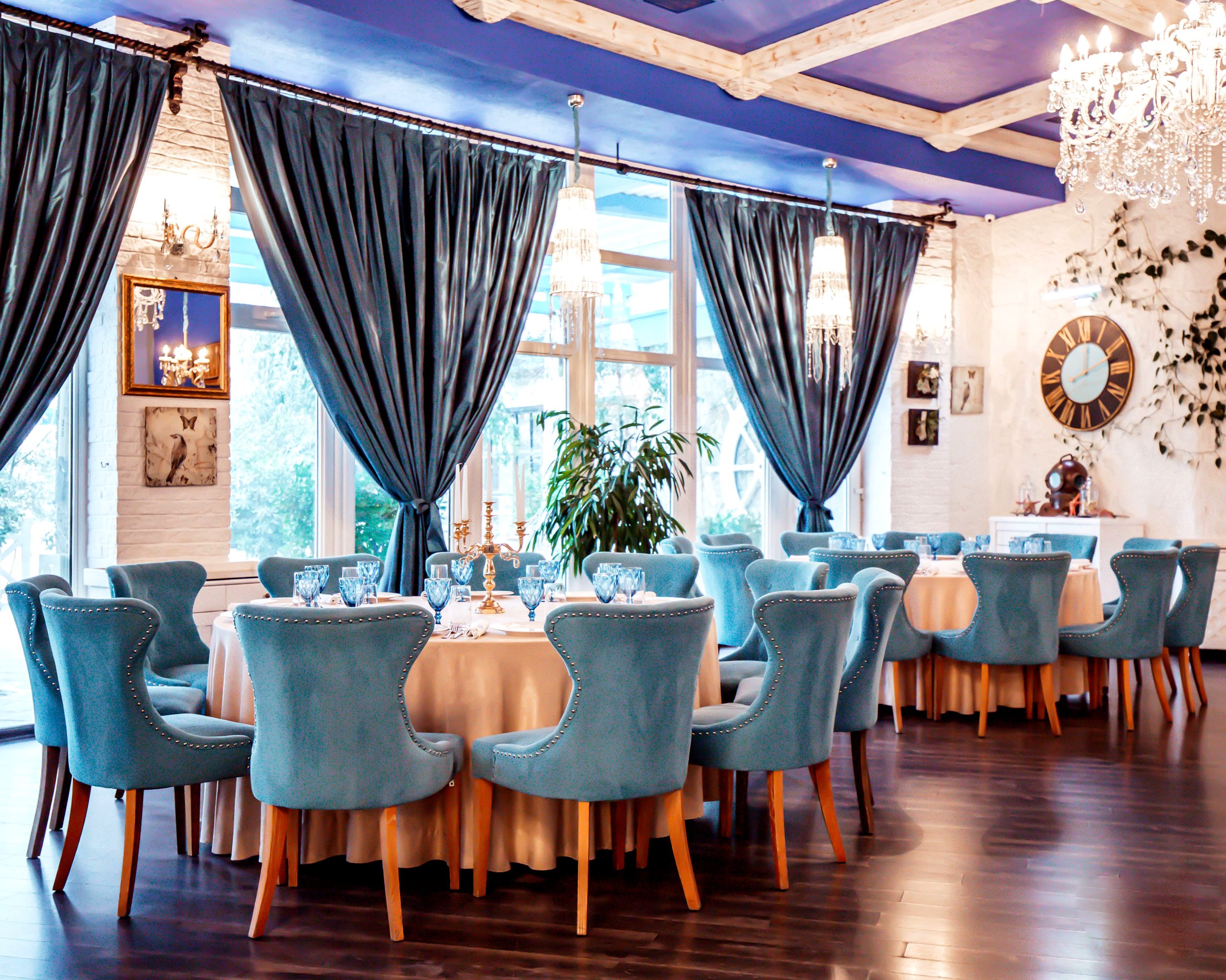 restaurant hall with blue chairs and decors on the wall
